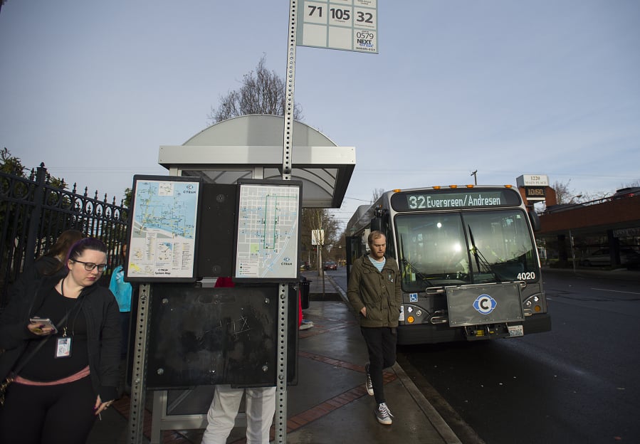 Kourtney Foley of Vancouver, left, joins fellow C-Tran riders as she makes her way off a bus in downtown Vancouver. Passengers can pay their fares in a variety of ways, but no change is given.