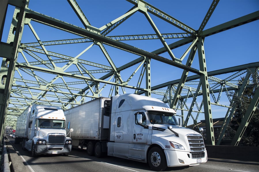 Trucks move across the Interstate 5 Bridge, which frequently sees traffic in excess of its design capacity.