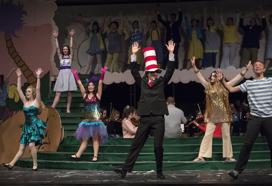 “Oh The Thinks You Can Think!” The cast of “Seussical,” fronted by Derek Tucker as the human Cat in the Hat, runs through dress rehearsal at Skyview High School. Up on the second level are the denizens of Whoville.