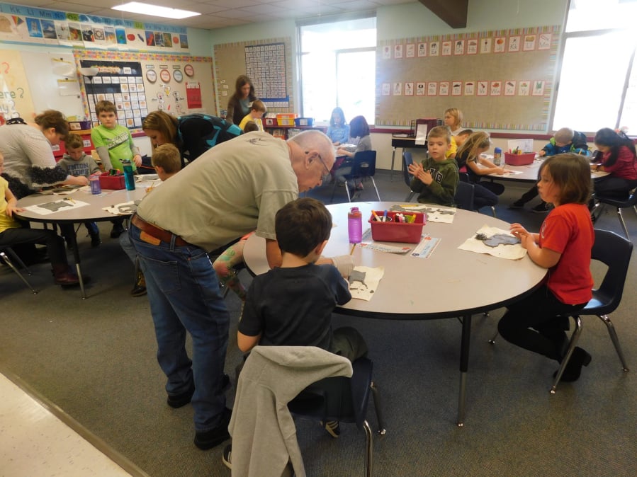 Ridgefield: Richard Moody, artist and retired teacher, showed Union Ridge Elementary School second-graders how to make ornaments out of clay.
