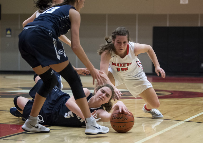 Skyview's Maddie Hendricks (5) and Camas' Katie Hancock (15) scramble for the ball during Friday night's game at Camas High School on Jan. 11, 2019.