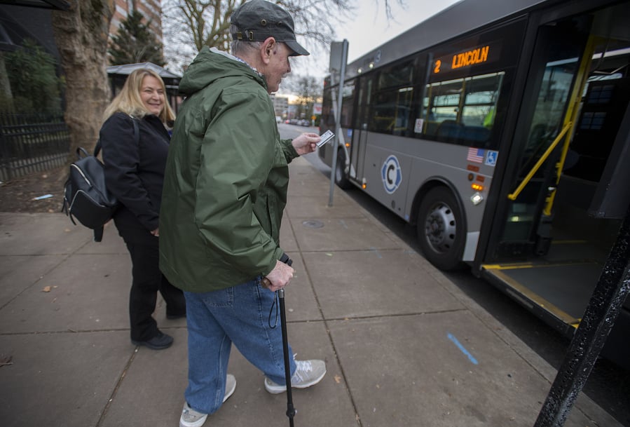 Veronica Marti, lead travel trainer for C-Tran, left, joins Vancouver resident John Prince as he catches a ride home Tuesday afternoon, Jan. 15, 2019.
