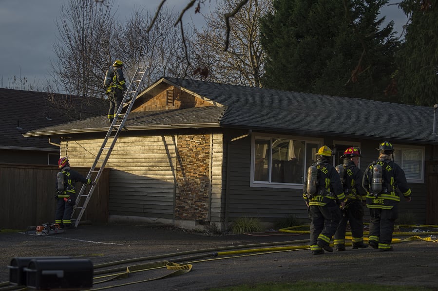 Firefighters respond Thursday afternoon to a small blaze in the kitchen and attic of a duplex unit at 1204 W. McLoughlin Blvd. in Vancouver.