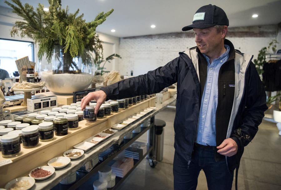 Jacobson Salt Co. founder Ben Jacobsen shows off some of his favorite infused salts at the company’s shop and event space in Portland. Some of the infused salts partner with other local companies like the Infused Stumptown Hair Bender Salt.