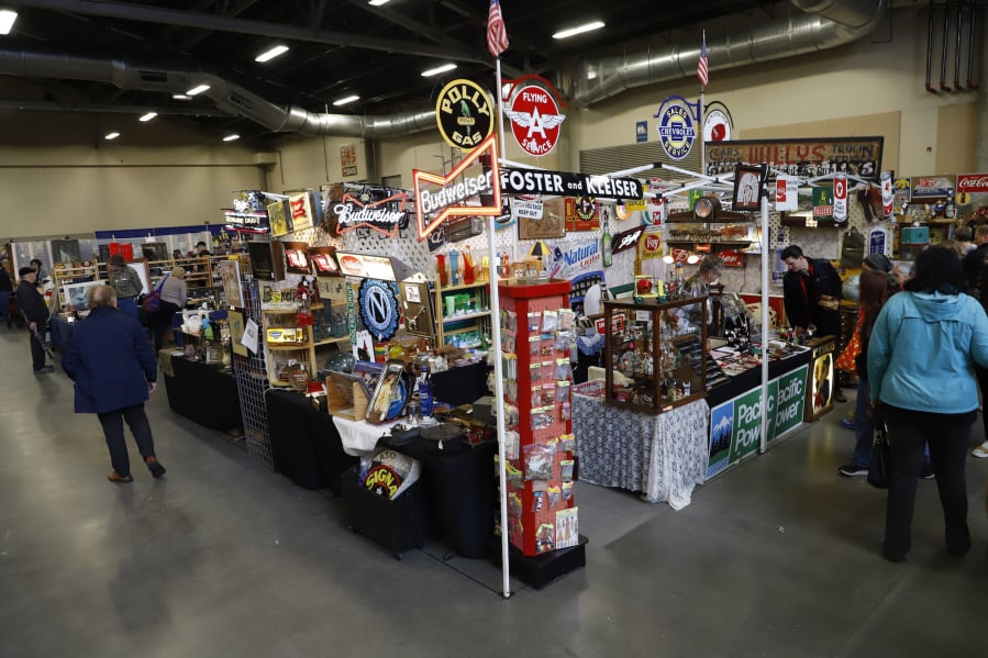 Shoppers browse an antique road show Sunday at the Clark County Event Center at the Fairgrounds.