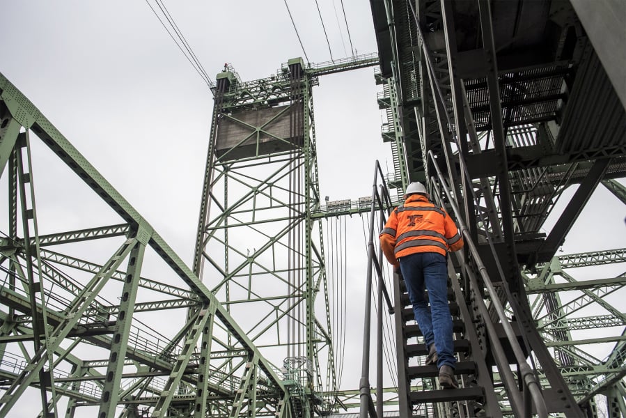 Interstate 5 Bridge Supervisor Marc Gross, with the Oregon Department of Transportation, climbs a ladder leading to the bridge’s machine room during a tour on Thursday morning.