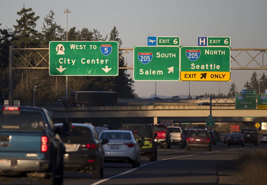 Traffic traveling west on state Highway 14 approaches the exit for Interstate 205 on Tuesday morning. In addition to an extra lane going in each direction, the project would create a peak-use westbound lane for use during heavy traffic periods.
