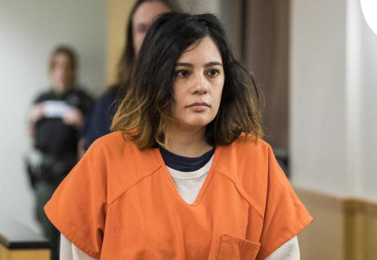 Emily Javier, 31, who’s accused of attacking her boyfriend with a samurai sword, enters the courtroom on Jan. 23 to plead guilty to attempted first-degree domestic violence murder in Clark County Superior Court.
