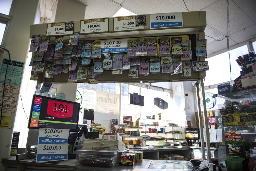 The counter display at the Bus Stop Market is adorned with winning lottery tickets. The store will close Feb. 15.