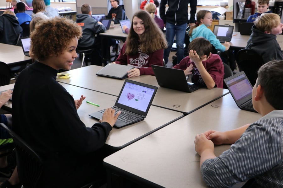 BATTLE GROUND - Students in Angela Minick’s seventh-grade class at Daybreak Middle School complete schoolwork on Google Chromebook laptops.