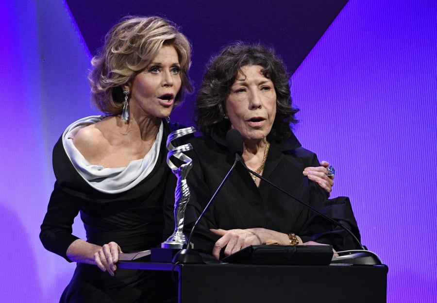 Presenters Jane Fonda, left, and Lily Tomlin address the audience during the 19th annual Costume Designers Guild Awards on Feb. 21, 2017, in Beverly Hills, Calif. Their Netflix comedy series “Grace and Frankie” has been renewed for season six.