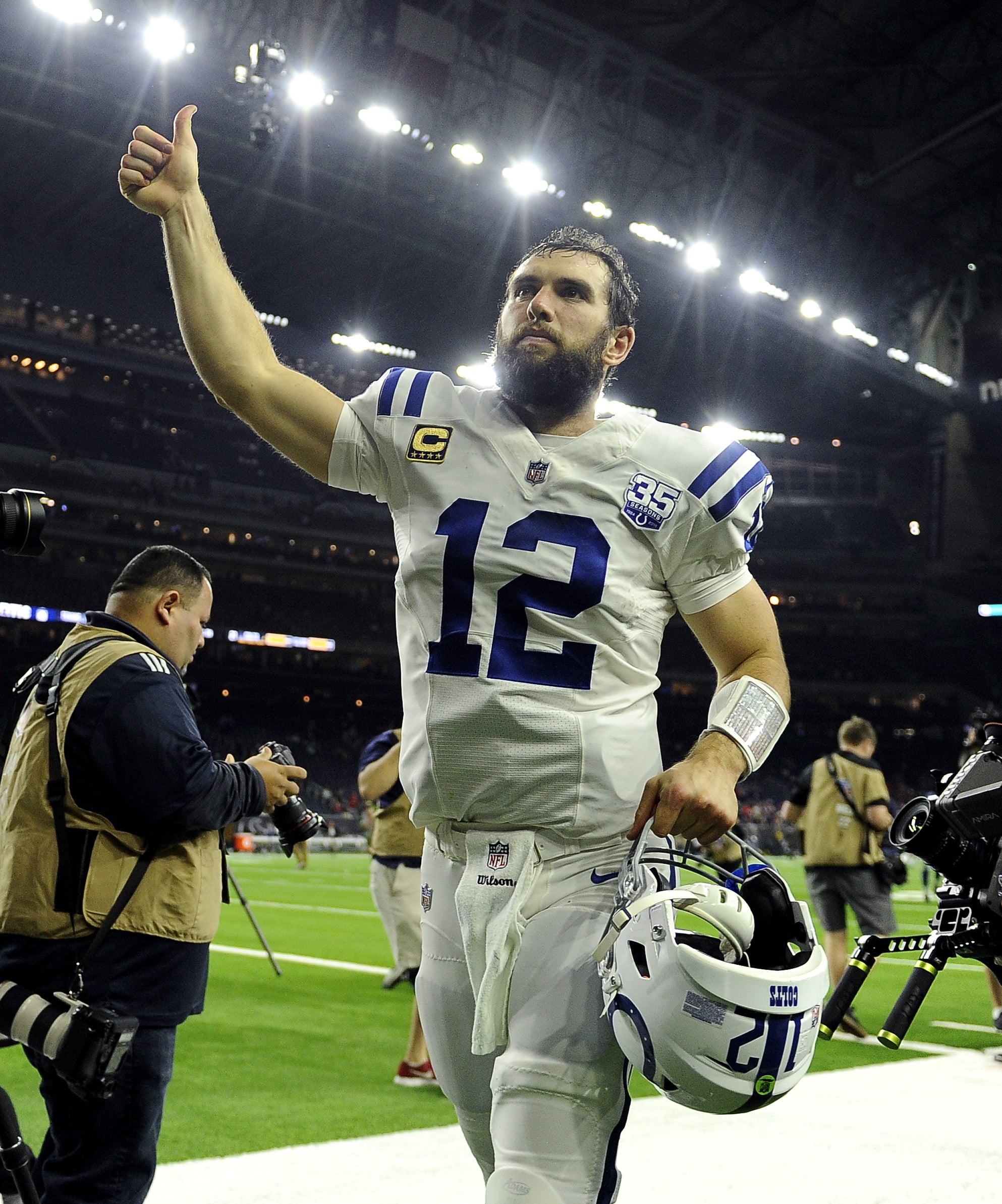 Indianapolis Colts quarterback Andrew Luck (12) runs off of the field after the team's win over the Houston Texans in an NFL wild card playoff football game, Saturday, Jan. 5, 2019, in Houston.