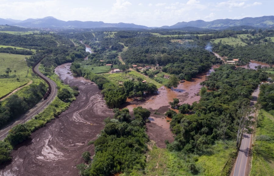 An aerial view shows flooding triggered by a dam collapse near Brumadinho, Brazil, Friday, Jan. 25, 2019. Brazilian mining company Vale SA said it didn’t yet have information on deaths or injuries at the dam but said that tailings have reached the community of Vila Ferteco.