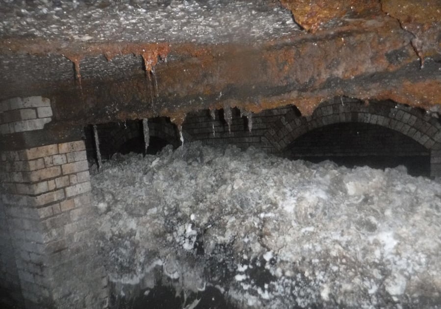 In this photo released Tuesday Jan. 8, 2019, by Britain’s South West Water company, showing part of a “fatberg”, a mass of hardened fat, oil and baby wipes, measuring some 64 meters (210 feet) long, in the town of Sidmouth, England. The fatberg is blocking a sewer in the southwestern English town, and will take a sewer team around eight weeks to dissect and dispose of the obstruction.