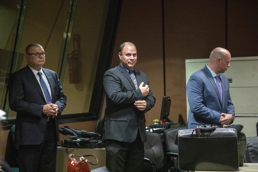 FILE - In this Oct. 30, 2018 file photo, from left, former Detective David March, Chicago Police Officer Thomas Gaffney and former officer Joseph Walsh appear at a pre-trial hearing in Chicago. The three Chicago police officers are accused of participating in a cover-up of the fatal shooting of Laquan McDonald.
