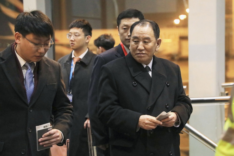 North Korean official Kim Yong Chol, right, prepares to leave the Beijing International Airport in Beijing Thursday, Jan. 17, 2019. Kim arrived in Beijing on Thursday, reportedly en route to the United States for talks ahead of a possible second summit between President Donald Trump and North Korean leader Kim Jong Un.