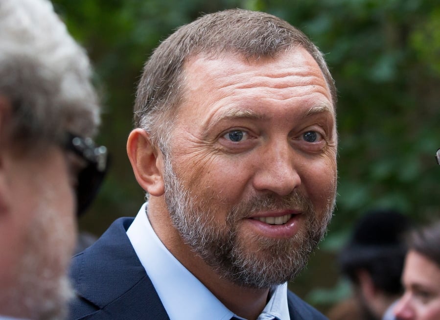 FILE- In this July 2, 2015, file photo, Russian metals magnate Oleg Deripaska attends Independence Day celebrations at Spaso House, the residence of the American Ambassador, in Moscow, Russia. The Senate has narrowly upheld a Treasury Department decision to lift sanctions from three companies connected to Russian oligarch Oleg Deripaska.