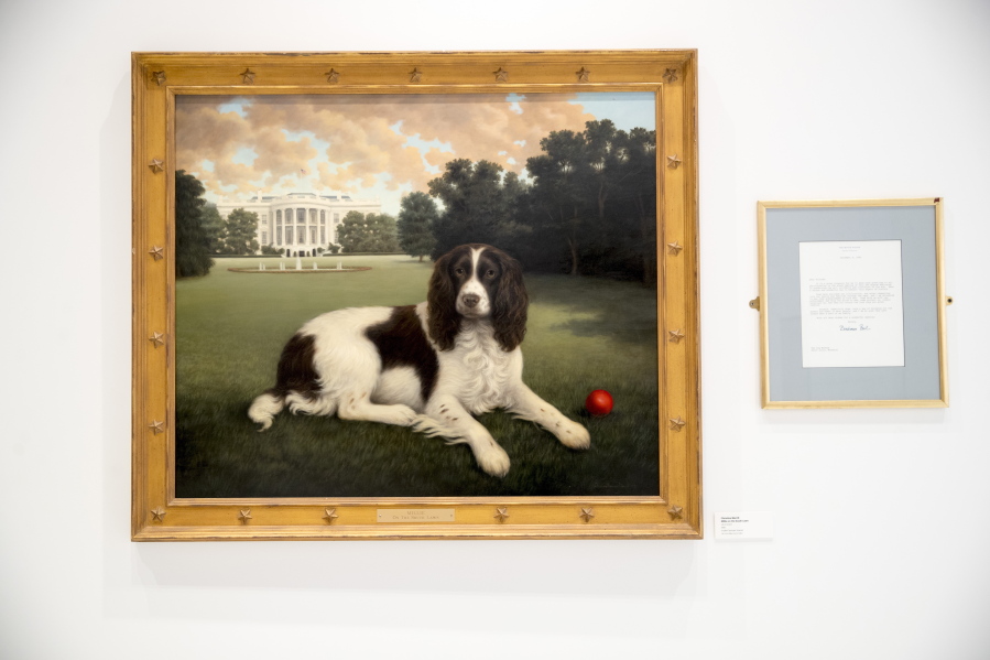 “Millie on the South Lawn” by Christine Merrill, alongside a letter from former first lady Barbara Bush, on display Jan. 9 at the American Kennel Club Museum of the Dog.