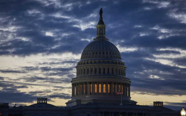 In this Jan. 8, 2019, file photo dawn arrives at the Capitol in Washington. On Thursday, Jan. 17, the Labor Department reports on the number of people who sought unemployment benefits last week, a figure likely to be inflated by applications from federal employees who aren't working because of the partial government shutdown. (AP Photo/J.