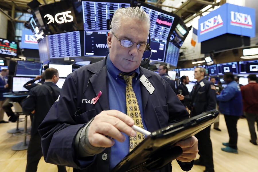 Trader Frank O’Connell works Jan. 11 on the floor of the New York Stock Exchange. The U.S. stock market opens at 9:30 a.m. EST on Friday, Jan. 18.
