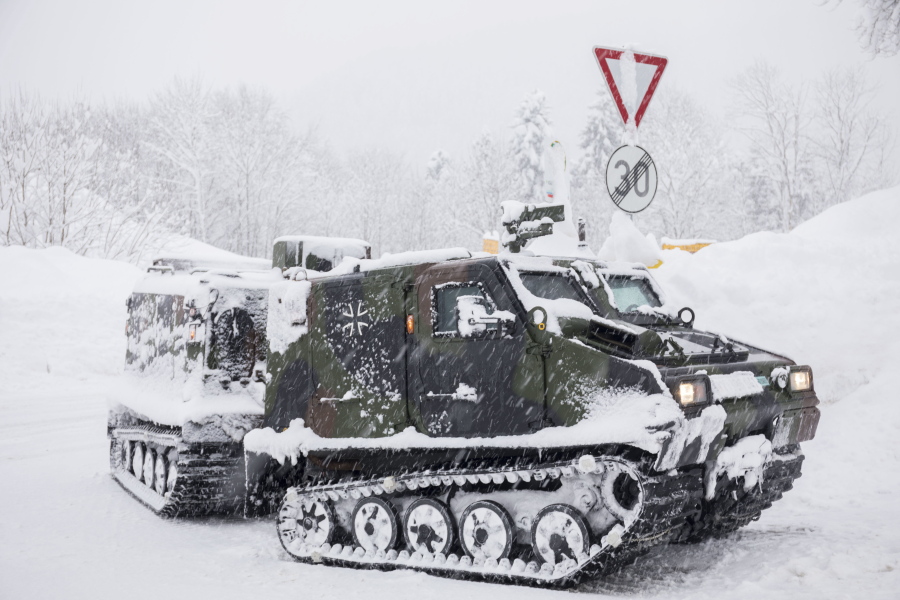 A track vehicle of the German army provides food to a village near Berchtesgaden, southern Germany, Thursday, Jan. 10, 2019 after southern Germany and Austria have been hit by heavy snowfall.