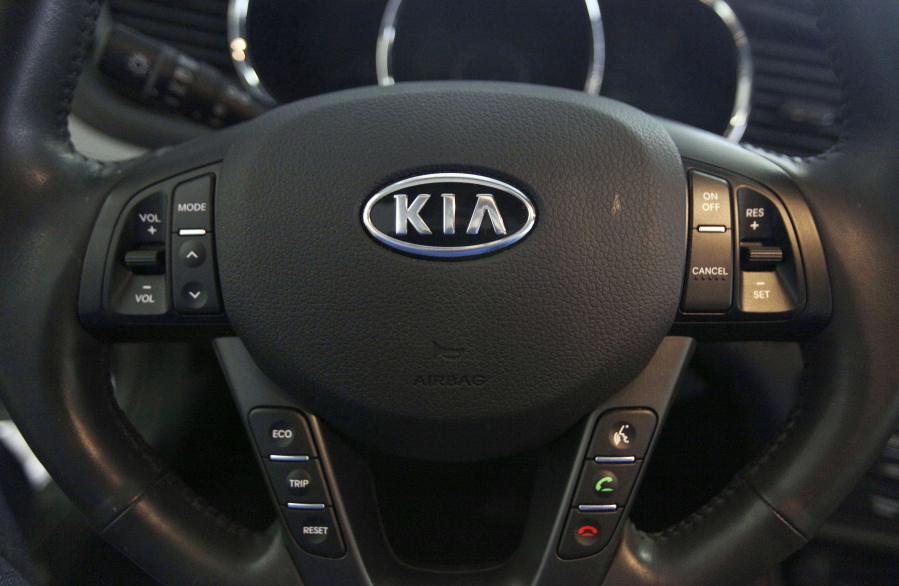 FILE- This Oct. 5, 2012, file photo, shows a Kia optima’s steering wheel inside of a Kia car dealership in Elmhurst, Ill. Kia says it will ignore the partial U.S. government shutdown and recall more than 68,000 vehicles to fix a fuel pipe problem that can cause engine fires. The problem stems from previous recall repairs due to engine failures. Kia is only doing the fix on 68,000 of its 618,000 vehicles. The fuel injector pipe recall covers some 2011 through 2014 Optima cars, 2012 through 2014 Sorrento SUVs, and 2011 through 2013 Sportage SUVs, all with 2-liter and 2.4-liter four-cylinder engines. (AP Photo/Nam Y.