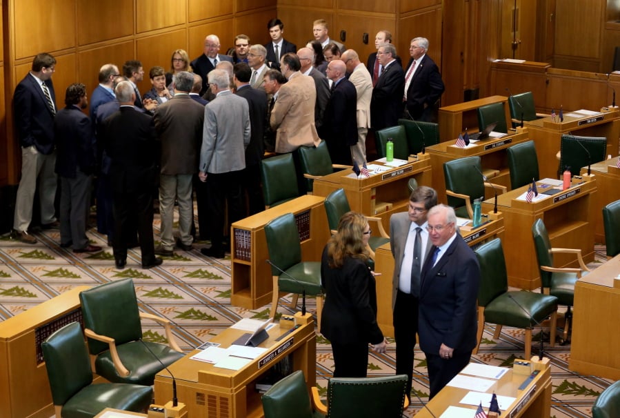 House Republicans meet in the back of the House floor May 21 during the opening of the Legislature special session at the Oregon State Capitol in Salem, Ore.