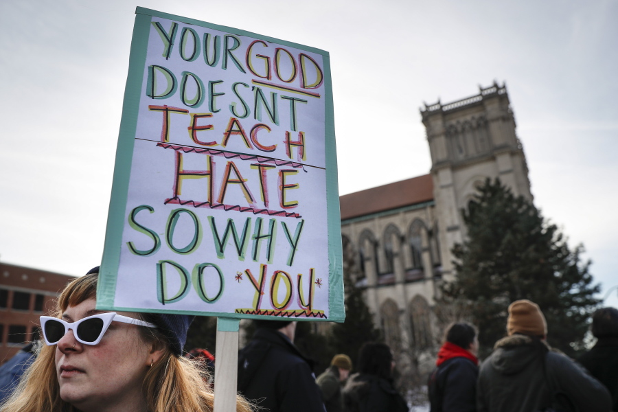 Protestors gather outside the Catholic Diocese of Covington Tuesday, Jan. 22, 2019, in Covington, Ky. The diocese in Kentucky has apologized after videos emerged showing students from Covington Catholic High School mocking Native Americans outside the Lincoln Memorial on Friday after a rally in Washington.