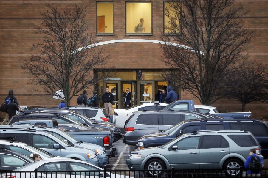 Students arrive at Covington Catholic High School as classes resume following a closing due to security concerns the previous day, Wednesday, Jan. 23, 2019, in Park Hills, Ky. A group of boys from the school went to Washington for an anti-abortion rally last Friday and their encounters with a Native American activist and a black religious sect were captured on video and spread on social media, drawing widespread criticism.