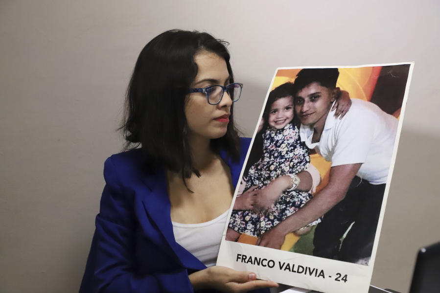 Francys Valdivia Machado, 28, holds a picture of her 24-year-old brother, Franco, who was killed during a protest against social security cuts in Esteli, Nicaragua, in April 2018.