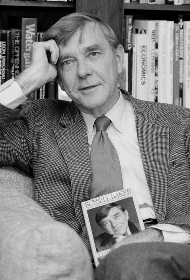 New York Times columnist and Pulitzer Prize winning author, Russell Baker, pictured on Oct. 17, 1983, at his office at the New York Times in New York, has died at age 93.