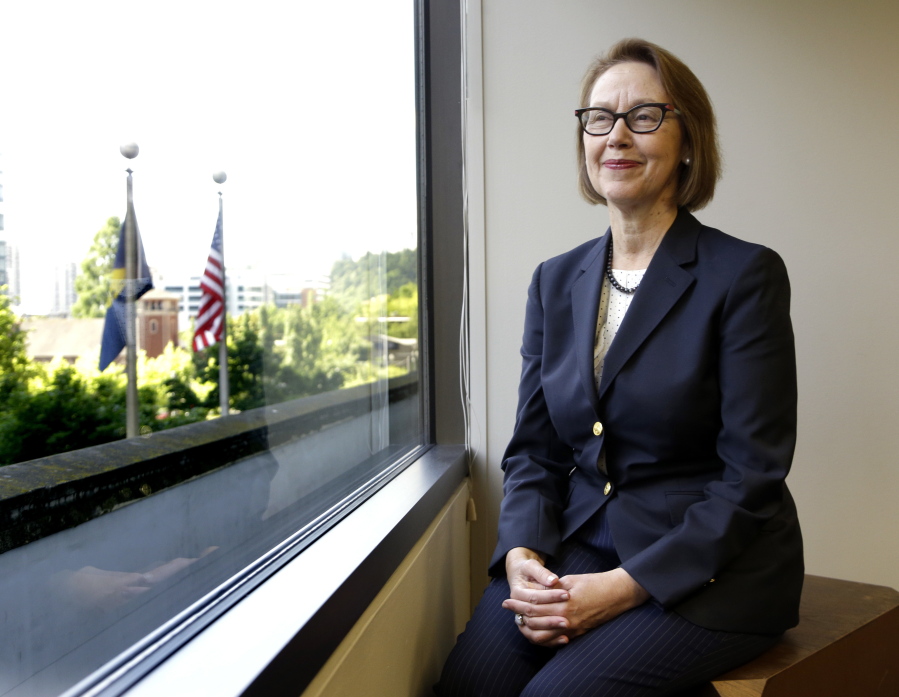 In this July 13, 2016, file photo, Oregon Attorney General Ellen Rosenblum poses for a photo at her office in Portland. Immigrants, Muslims, people of color, top law enforcement officers and state officials packed into a room on Monday, Jan. 7, 2019, to discuss the sharp rise of hate crimes in Oregon, and what to do about it. The “listening session” was organized by Rosenblum’s task force on hate crimes to help craft legislation to strengthen the state’s hate-crime laws.