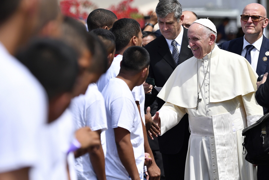 Before departing Pope Francis shakes hands with inmates after a penitential liturgy at the Las Garzas de Pacora detention center for minors, in Panama, Friday, Jan. 25, 2019. Francis on Friday denounced how society puts up “invisible walls” to marginalize sinners and criminals as he brought World Youth Day to Panama’s juvenile delinquents who can’t participate in the Catholic Church’s big festival of faith.