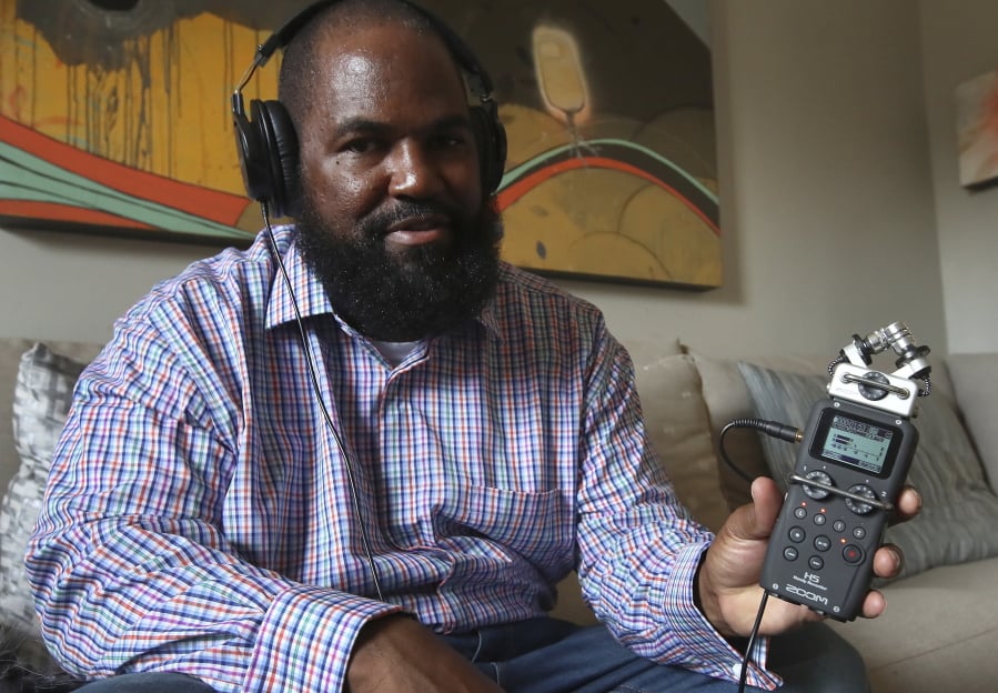 In this Dec. 19, 2018, photo, Earlonne Woods shows recording equipment similar to what he used in San Quentin State Prison to produce his podcasts, during an interview in Oakland, Calif. Woods, 47, was recently released from San Quentin prison after California Gov. Jerry Brown commuted his 31-years-to-life sentence for attempted armed robbery. Brown cited Woods’ leadership in helping other inmates and his work at “Ear Hustle,” a podcast he co-hosts and co-produces that documents everyday life inside the prison. “Ear Hustle” launched in 2017. Its roughly 30 episodes have been downloaded a total of 20 million times by fans all over the world.