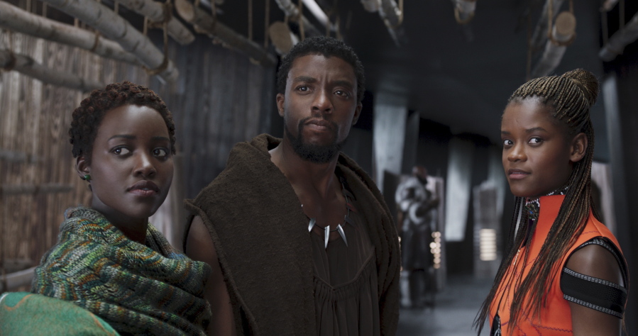 FILE - This file image released by Disney shows Lupita Nyong’o, from left, Chadwick Boseman and Letitia Wright in a scene from “Black Panther.” The producers behind hits “Black Panther,” “Crazy Rich Asians,” “A Star Is Born” and “Bohemian Rhapsody” are among the 10 nominees for the top prize at the Producers Guild Awards announced Friday, Jan. 4, 2019.