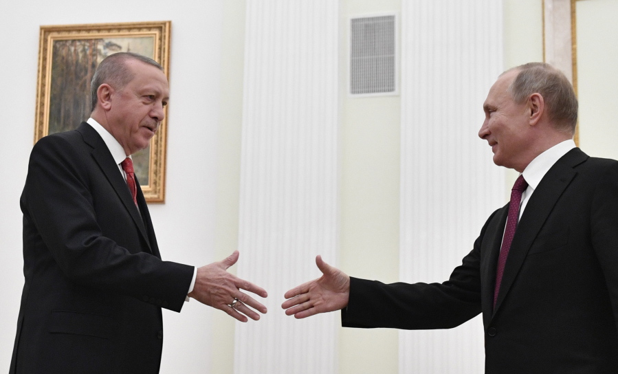 Russian President Vladimir Putin, right, greets Turkey’s President Recep Tayyip Erdogan prior to their talks in the Kremlin in Moscow, Russia, Wednesday, Jan. 23, 2019.
