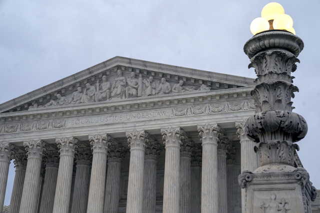 In this Jan. 7, 2019 photo, The Supreme Court is seen in Washington,. The Supreme Court is allowing the Trump administration to go ahead with its plan to restrict military service by transgender men and women while court challenges continue. The high court on Tuesday reversed lower-court orders preventing the Pentagon from implementing its plans. The high court for now declined to take up cases about the plan. The cases will continue to move through lower courts. (AP Photo/J.