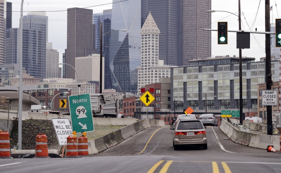 Traffic near the football and baseball stadiums south of downtown merges onto northbound Highway 99 and toward the Alaskan Way Viaduct ahead of the ramp’s closure next week, Wednesday, Jan. 2, 2019, in Seattle. The on-and-off ramps to the viaduct close Friday evening, Jan. 4. One week later, Jan. 11, the entire Alaskan Way Viaduct permanently closes to begin the work needed to realign the highway into a new tunnel. The two-mile, double-decker traffic tunnel replaces the viaduct, damaged in an earthquake in 2001.