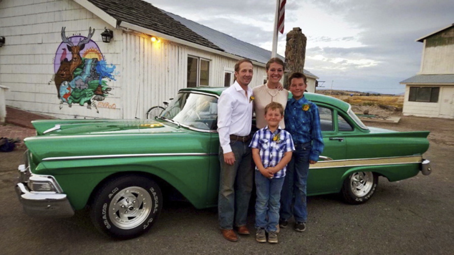 This recent photo provided by Jasmine Tool shows herself with her fiance Daniel Jastrab and their sons Jameson, right, and Silas. Tool, an ailing U.S. Fish and Wildlife Service worker in Oregon, says she can’t learn why her federally paid insurance lapsed months ago or get it reinstated because of the partial government shutdown. Tool is now scrambling to find a way to pay for nutrients that keep her alive.