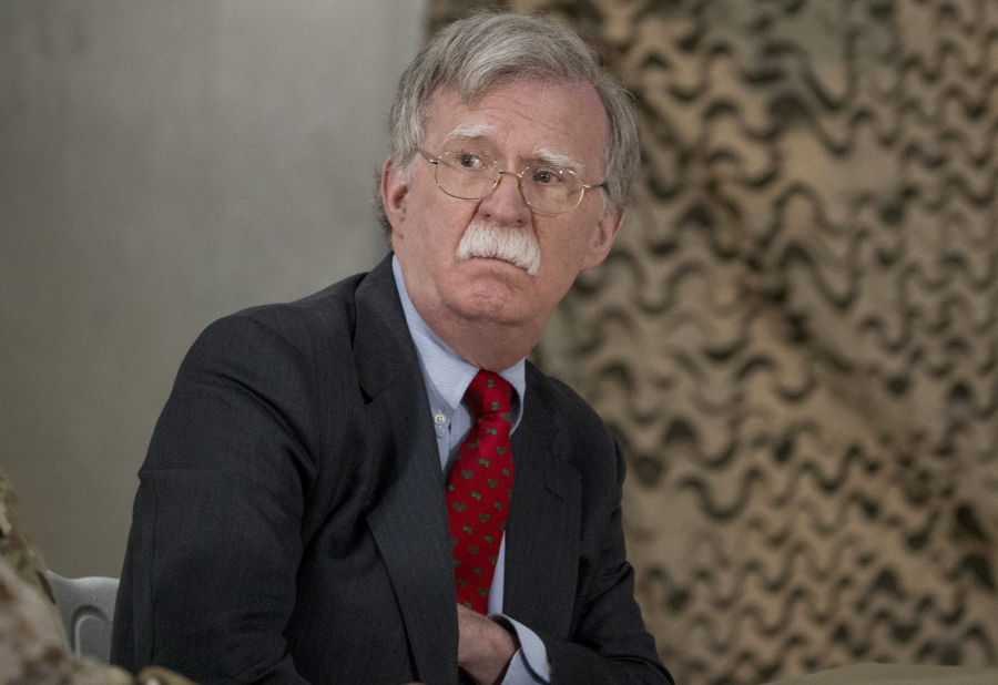 FILE - In this Dec. 26, 2018 file photo, National Security Adviser John Bolton attends a meeting with President Donald Trump and senior military leadership at Al Asad Air Base, Iraq. On Monday, Jan. 7, 2018, a Syrian Kurdish official said Syria’s Kurds are awaiting clarifications from the U.S. over America’s withdrawal plans following comments made by Bolton which appeared to contradict earlier comments by President Donald Trump. Bolton, on a visit to Israel Sunday, said U.S. troops will not leave northeastern Syria until IS militants are defeated and American-allied Kurdish fighters are protected.