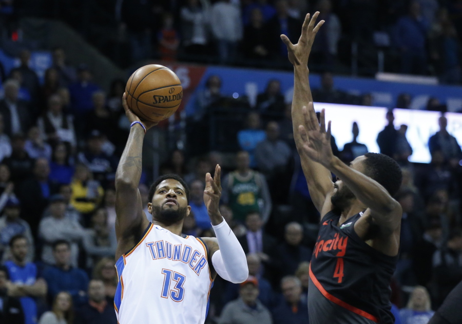 Oklahoma City Thunder forward Paul George (13) shoots in front of Portland Trail Blazers forward Maurice Harkless (4) in the first half of an NBA basketball game in Oklahoma City, Tuesday, Jan. 22, 2019.