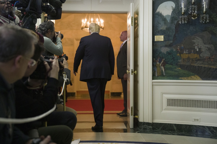President Donald Trump departs after speaking about the partial government shutdown, immigration and border security Saturday in the Diplomatic Reception Room of the White House.