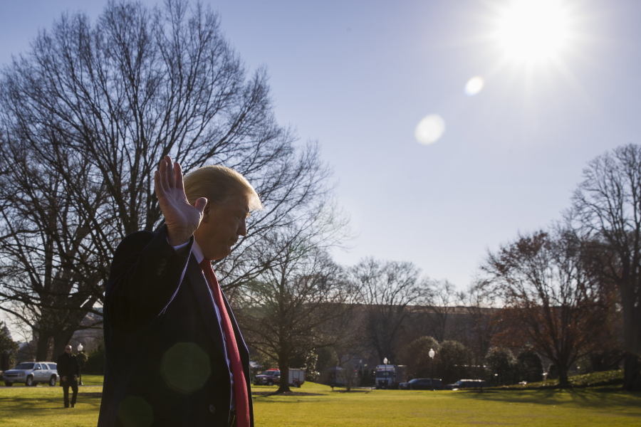 President Donald Trump waves as he departs after speaking on the South Lawn of the White House as he walks to Marine One, Sunday, Jan. 6, 2019, in Washington. Trump is en route to Camp David.