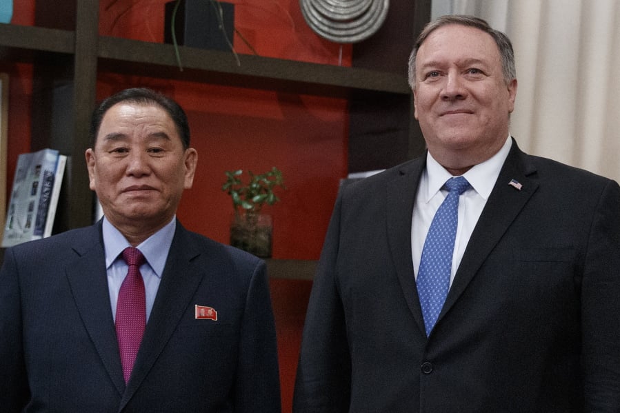 Secretary of State Mike Pompeo, right, and Kim Yong Chol, a North Korean senior ruling party official and former intelligence chief, pose for photographs at the The Dupont Circle Hotel in Washington, Friday, Jan. 18, 2019.