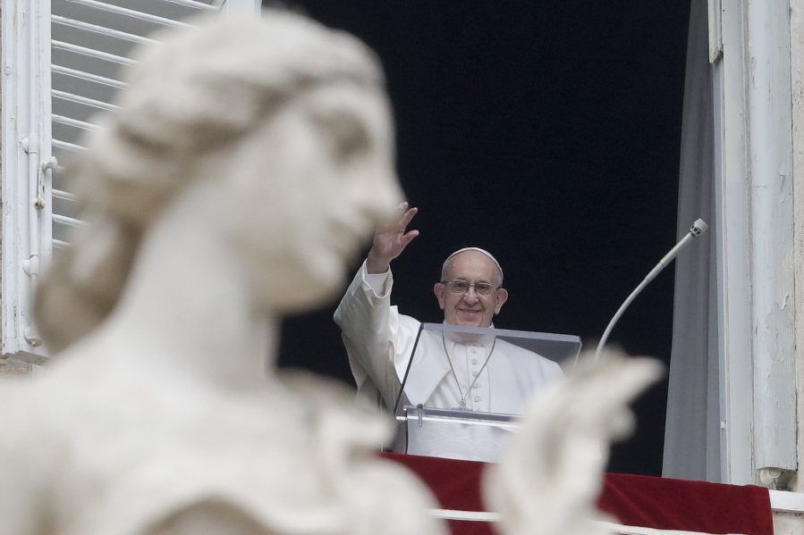 Pope Francis waves to the crowd gathered to attend the Angelus noon prayer he recited from the window of his studio overlooking St. Peter’s Square, at the Vatican, Sunday, Jan. 20, 2019. Pope Francis has prayed for peace in Colombia after the Bogota bombing at a police academy. Francis told faithful in St. Peter’s Square Sunday that he wanted to assure the Colombian people of his closeness after the “grave terrorist attack” on Jan. 17 that claimed 21 lives.