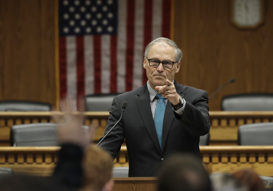 Gov. Jay Inslee takes questions from reporters following his speech Thursday at The Associated Press Legislative Preview at the Capitol in Olympia. The Legislature opens the 2019 session on Monday. (Ted S.