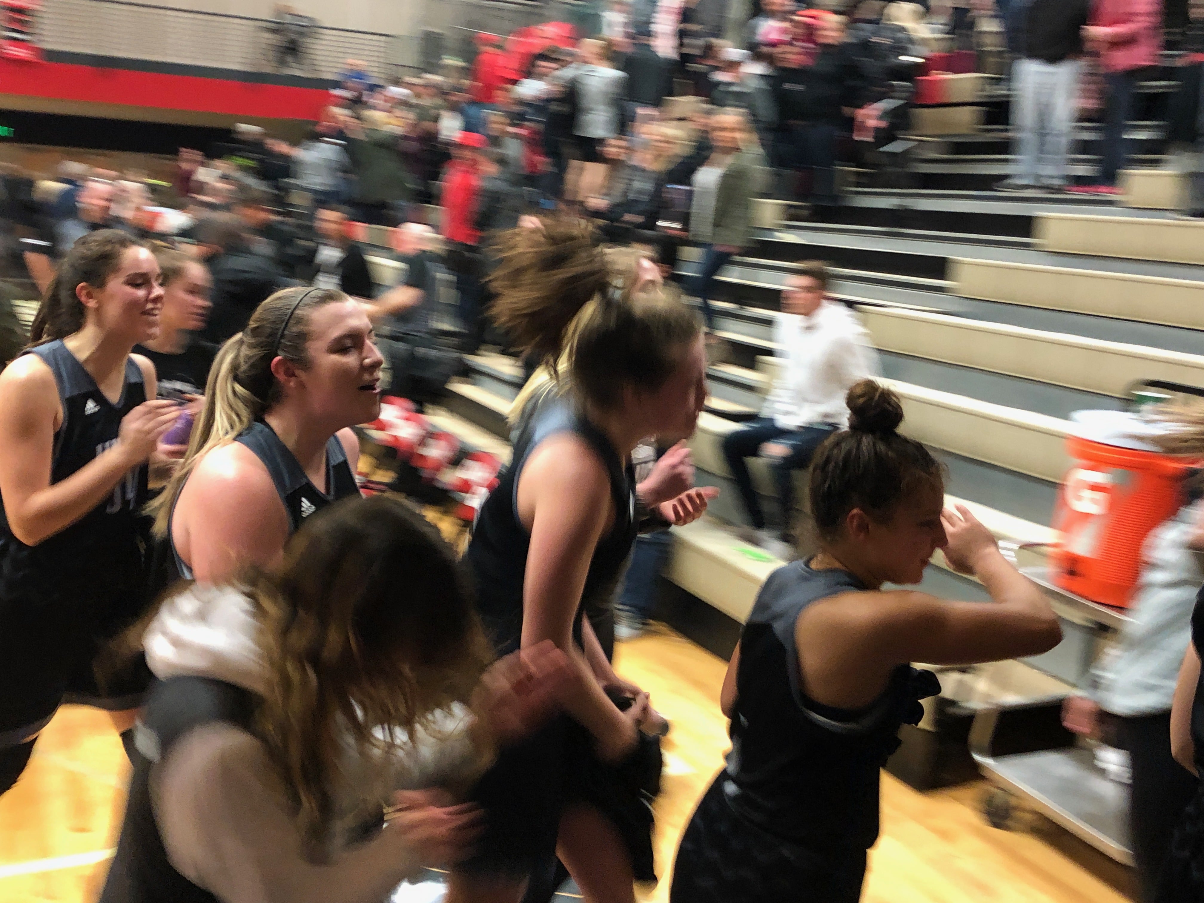 The Union girls basketball team celebrates while exiting the floor after a 53-44 win at Camas on Friday night.