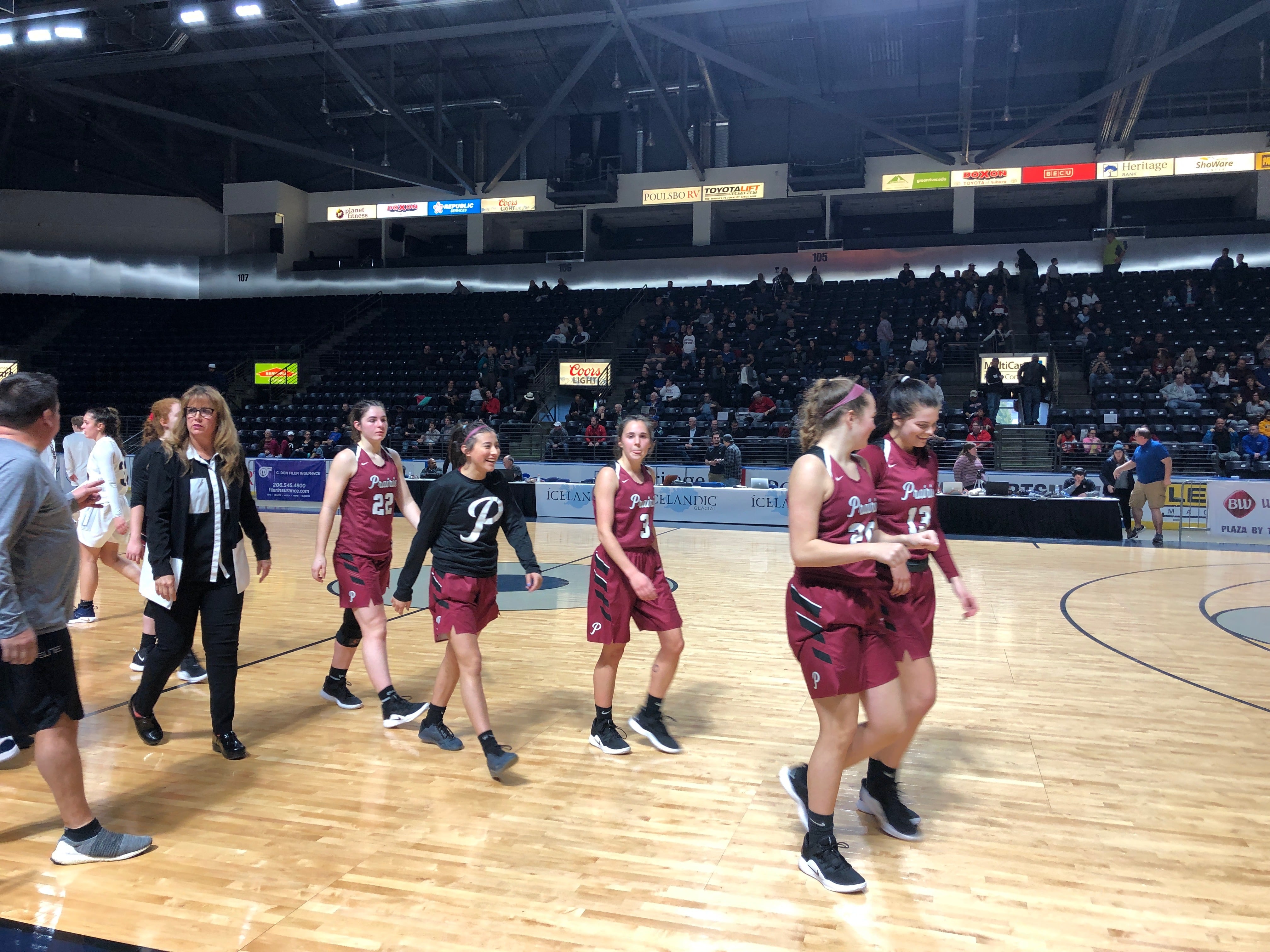 The Prairie girls basketball team walks off the ShoWare Center floor after beating No. 5-ranked West Seattle 58-50 in the King Showcase on Monday.