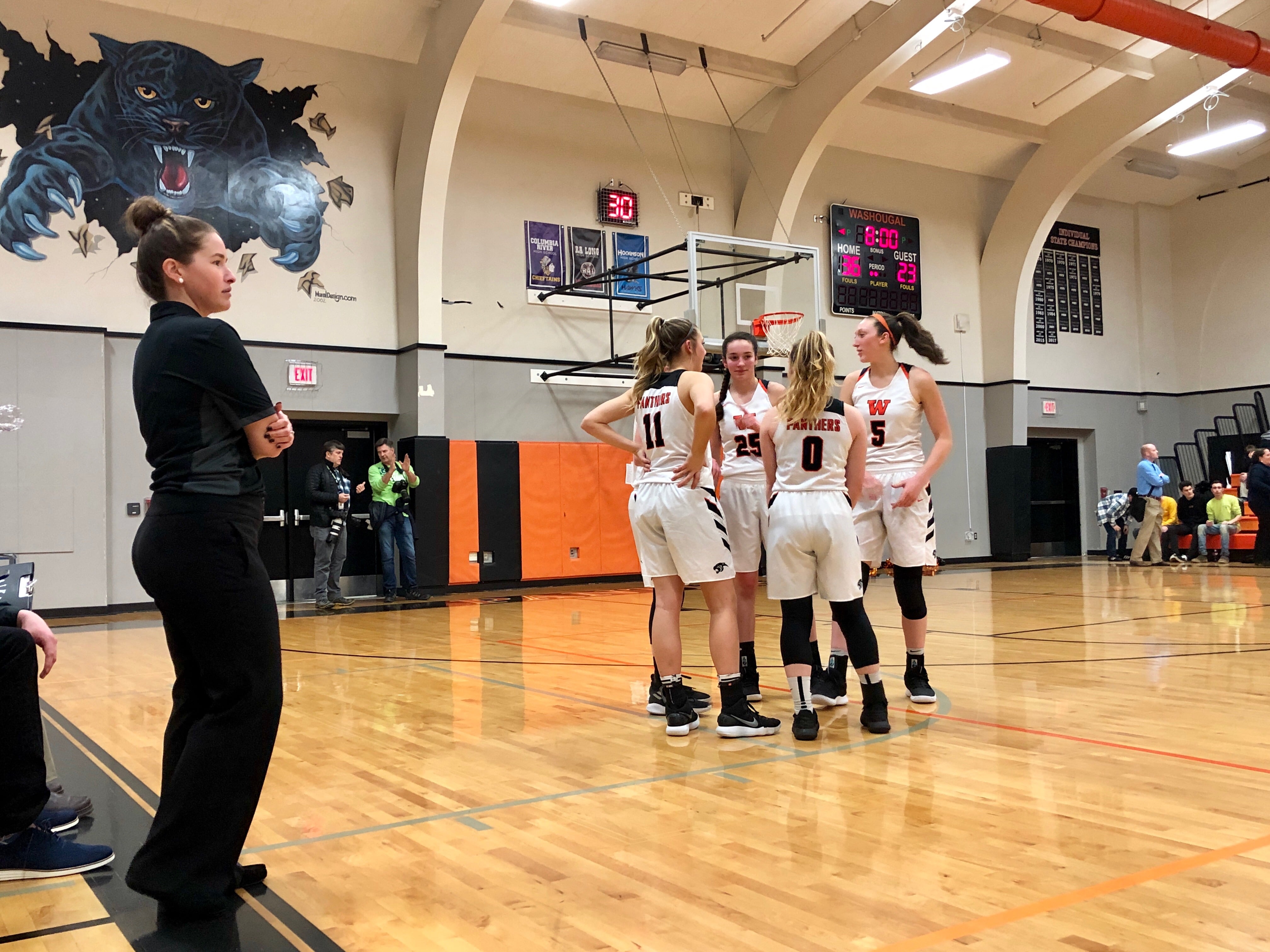 The Washougal girls basketball team prepares to take the floor for the second half of a 71-39 league title-clinching win over Woodland on Thursday night at Woodland High School.