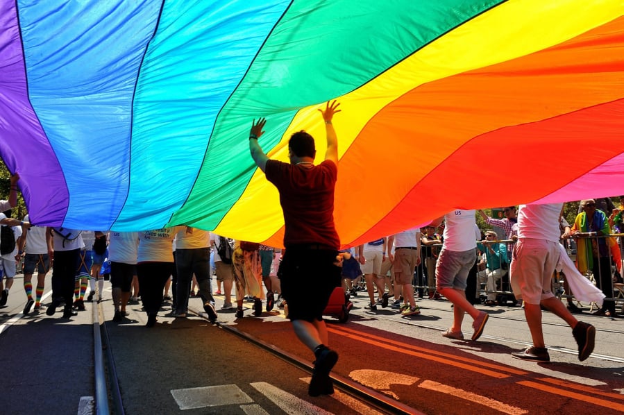 Parade participants march down Market Street carrying the rainbow flag in June 2013 during the annual Gay Pride parade in San Francisco.